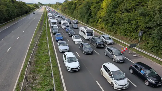 rows of cars stuck in traffic on M5