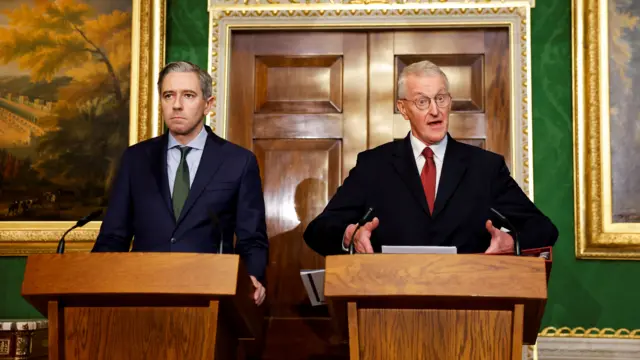 Simon Harris, left and Hilary Benn, right