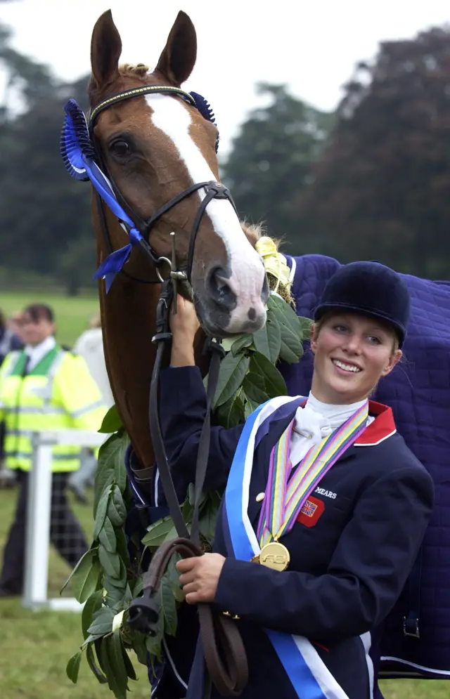 Zara Phillips wears her gold medal and poses with her horse Toytown