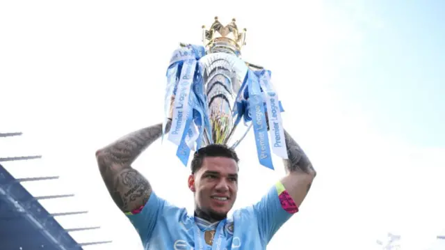 Ederson with Premier League trophy