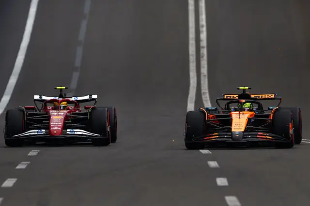 Lewis Hamilton and Lando Norris drive their cars on track in Baku