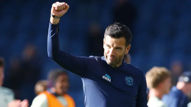 Cardiff boss Brian Barry-Murphy punching the air after their draw at Stockport