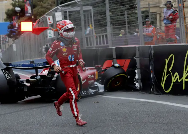 Charles Leclerc runs away from his crashed Ferrari