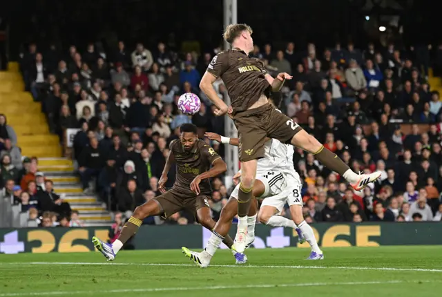 Ethan Pinnock heads the ball