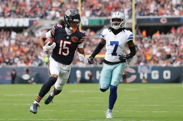 Rome Odunze scores a touchdown against the Dallas Cowboys