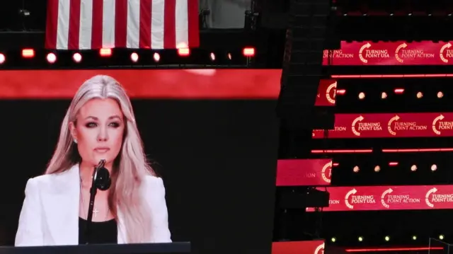 Erika Kirk speaks during a memorial service for her husband, slain conservative commentator Charlie Kirk, at State Farm Stadium in Glendale