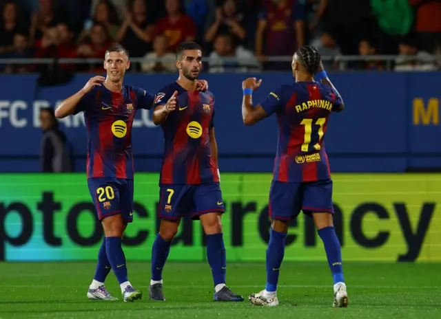 Torres is congratulated by teammates after scoring