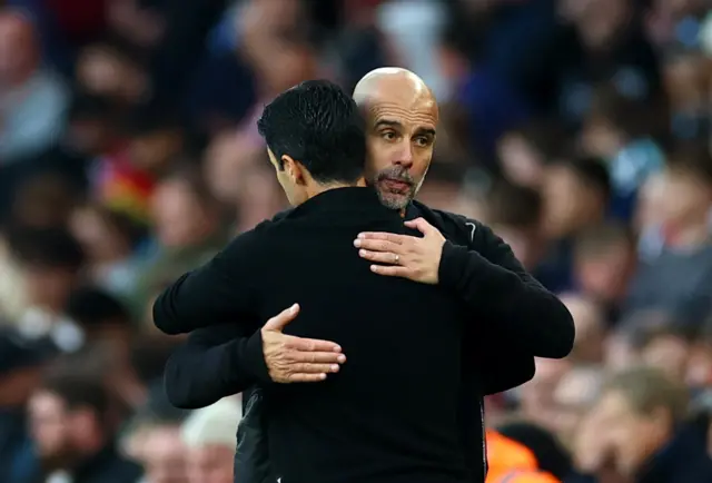 Mikel Arteta and Pep Guardiola embrace