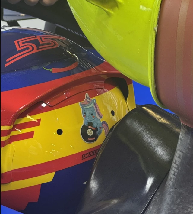 The unicorn sticker, designed by a fan, on Carlos Sainz's race helmet