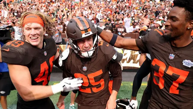 Andre Szmyt of the Cleveland Browns celebrates with team-mates after kicking the game-winning field goal against the Green Bay Packers