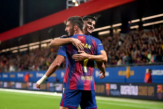 Pedri hugs Torres after his goal