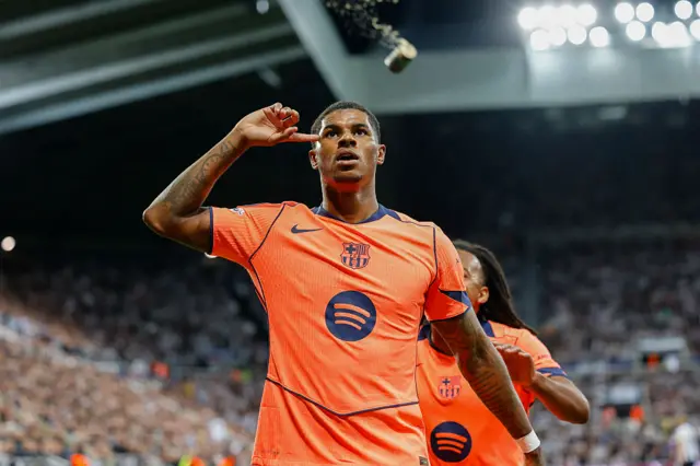 Marcus Rashford celebrating by pointing to his head