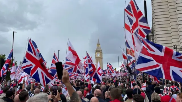 Activists reach Westminster during the Tommy Robinson-led Unite the Kingdom march and rally in central London