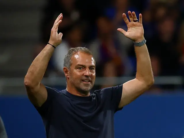 Flick throws his hands in the air in frustration