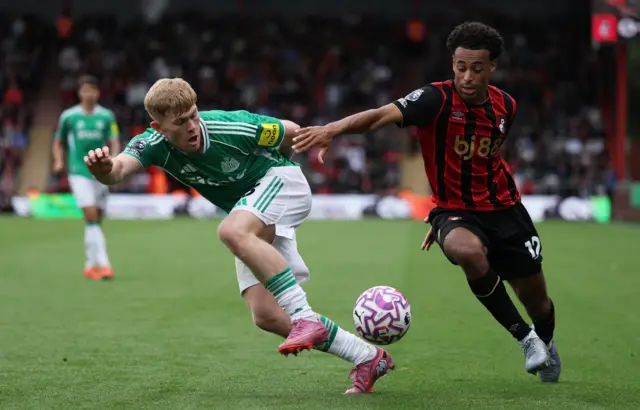 Newcastle United's Lewis Hall in action with AFC Bournemouth's Tyler Adams