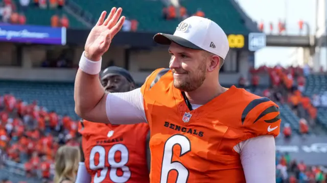 Cincinnati Bengals quarterback Jake Browning waves to fans after a game at Paycor Stadium