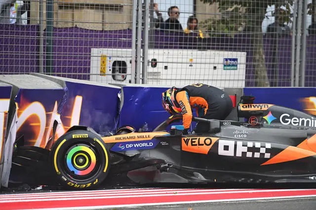 Oscar Piastri climbs out of the car after crashing