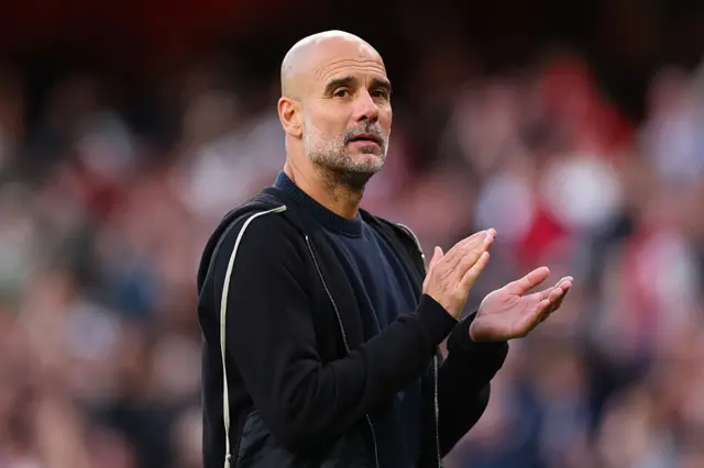 Pep Guardiola claps
