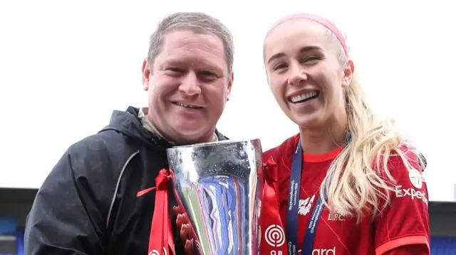 Matt Beard and Missy Bo Kearns with the FA Women's Championship trophy