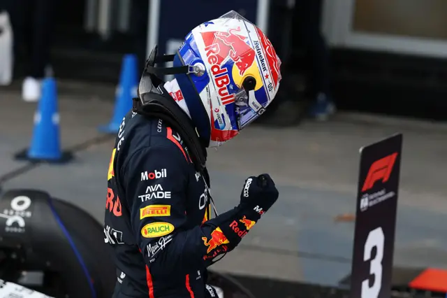 Max Verstappen clenches his fist as he celebrates claiming pole position in Baku