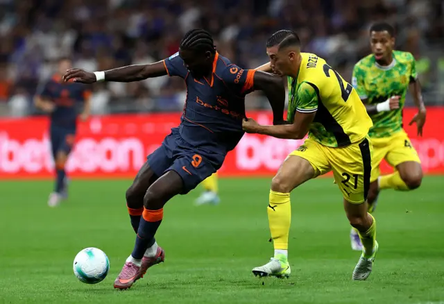 Thuram holds off a defender