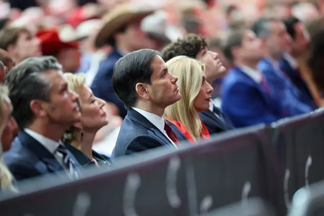 Rubio, centre, looks on to the stage. To his right in background are education secretary Linda McMahon and and defence secretary Pete Hegseth