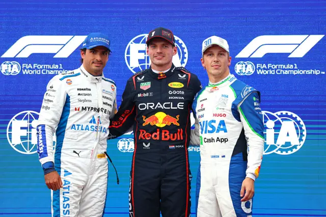 Carlos Sainz, Max Verstappen and Liam Lawson pose for photos after qualifying