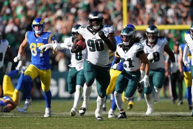 Philadelphia Eagles defensive lineman Jordan Davis returns a blocked kick for a touchdown against the Los Angeles Rams