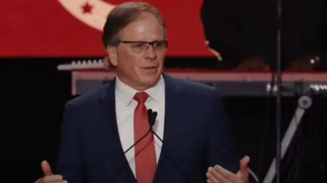Frank Turek speaks into a microphone