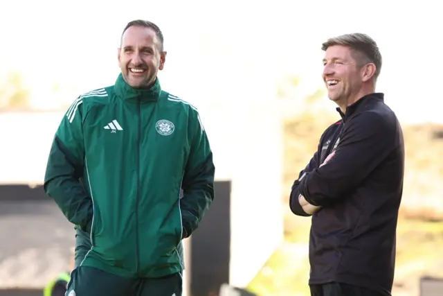 Partick Thistle head coach Mark Wilson shares a joke with Celtic assistant John Kennedy