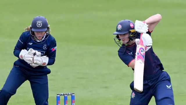 Gaby Lewis plays a cut shot as wicketkeeper Rhianna Southby watches on