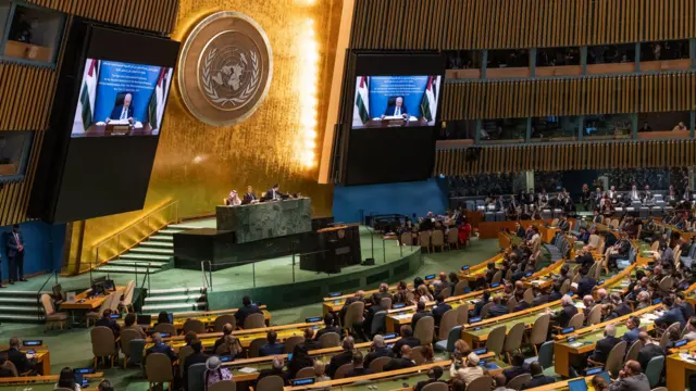A wide shot of the UN hall as Abbas speaks