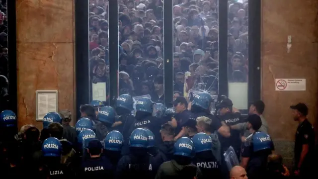 Protesters and policemen clash at Milan's Central Station during a protest as part of the nationwide strike with the slogan 'Let's Block Everything' in solidarity with Palestinians in Gaza and call for a halt to arms shipments to Israel