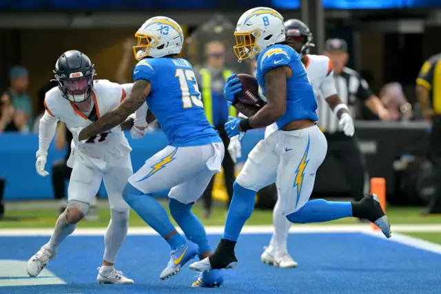 Omarion Hampton scores a touchdown for the Los Angeles Chargers against the Denver Broncos