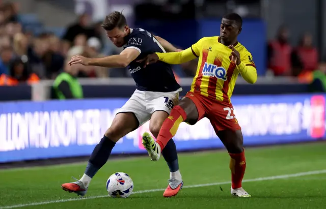 Ryan Leonard of Millwall is challenged by Nampalys Mendy of Watford