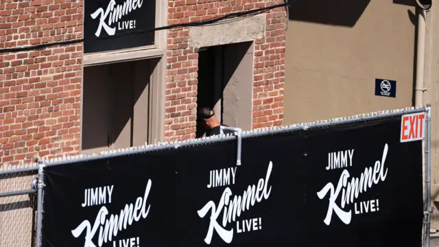 A person enters the theatre where "Jimmy Kimmel Live!" was recorded for broadcast following announcement by Disney that "Jimmy Kimmel Live" will return to its ABC network lineup on Tuesday, in Los Angeles, California