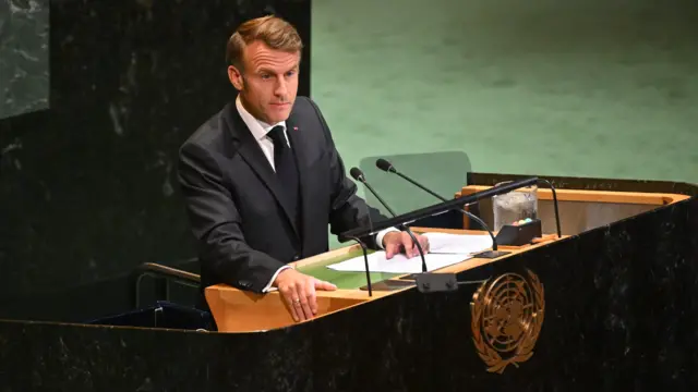 Emmanuel Macron at UN podium in dark suit