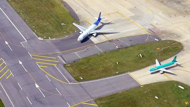 An aerial view of a plane on the runway at Gatwick