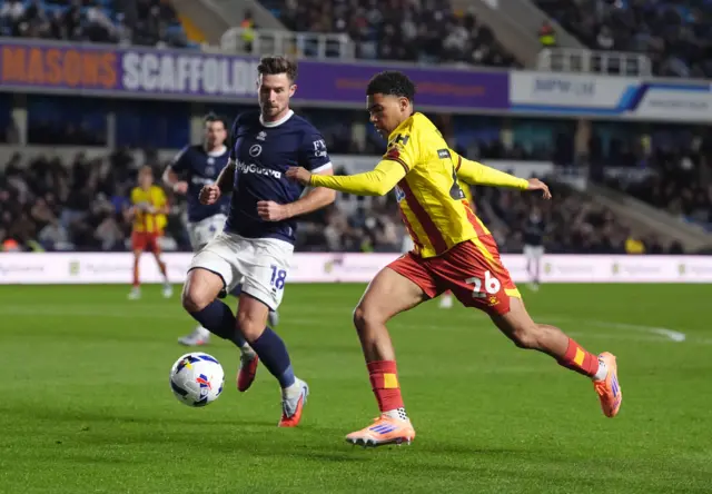Millwall's Ryan Leonard and Watford's Caleb Wiley battle for the ball