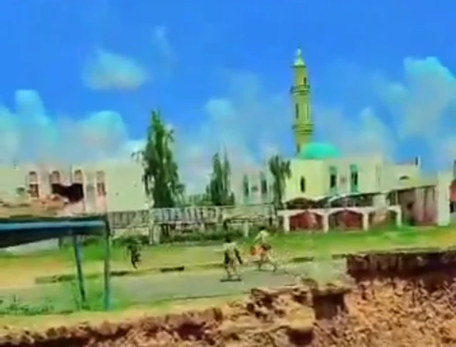 A screengrab from the footage showing the minaret of the mosque that helped geolocate where the footage was filmed