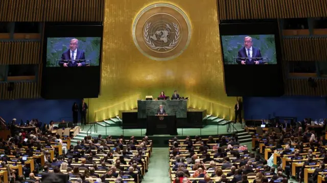 Guterres speaking to the hall, a wide shot of all the delegates sitting in rows