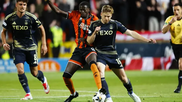 Dundee United's Panutche Camara and Aberdeen's Stuart Armstrong and