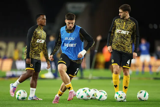Doherty runs with the ball in the warm up at Molineux