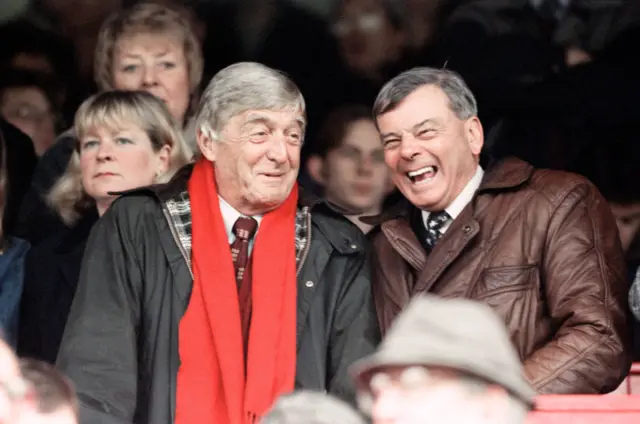 Michael Parkinson TV Presenter and Harold Dickie Bird former cricket umpire share a joke in the stands at the Barnsley v Bradford football match