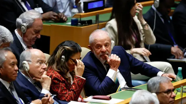 President of Brazil Luiz Inacio Lula Da Silva (R) listens as US President Donald Trump speaks