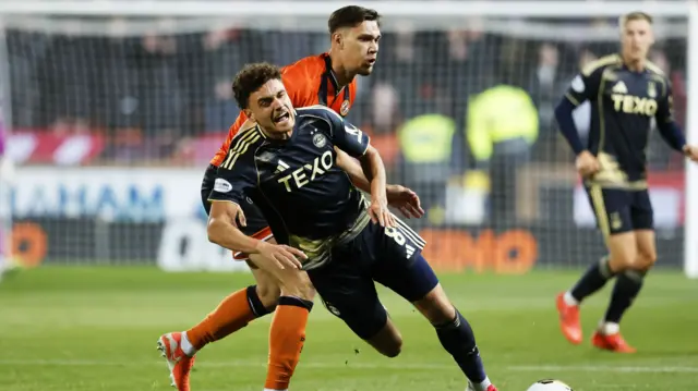 Dundee United's Krisztian Keresztes and Aberdeen's Dante Polvara and