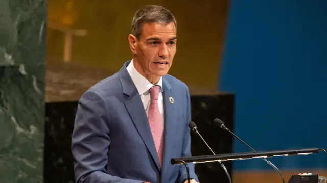 Spanish Prime Minister Spain Pedro Sanchez speaks at the United Nations (UN) headquarters in New York wearing a grey suit and pink tie