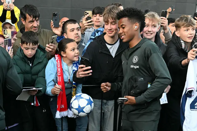 Estevao poses for photos with fans
