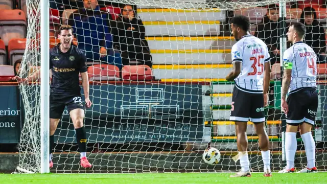 Mark McKenzie celebrates after scoring for Ayr United against Dunfermline Athletic
