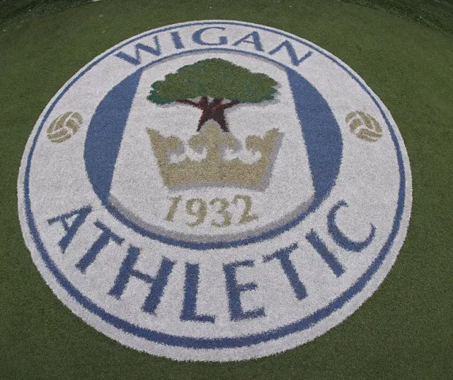 Wigan Athletic badge on the ground